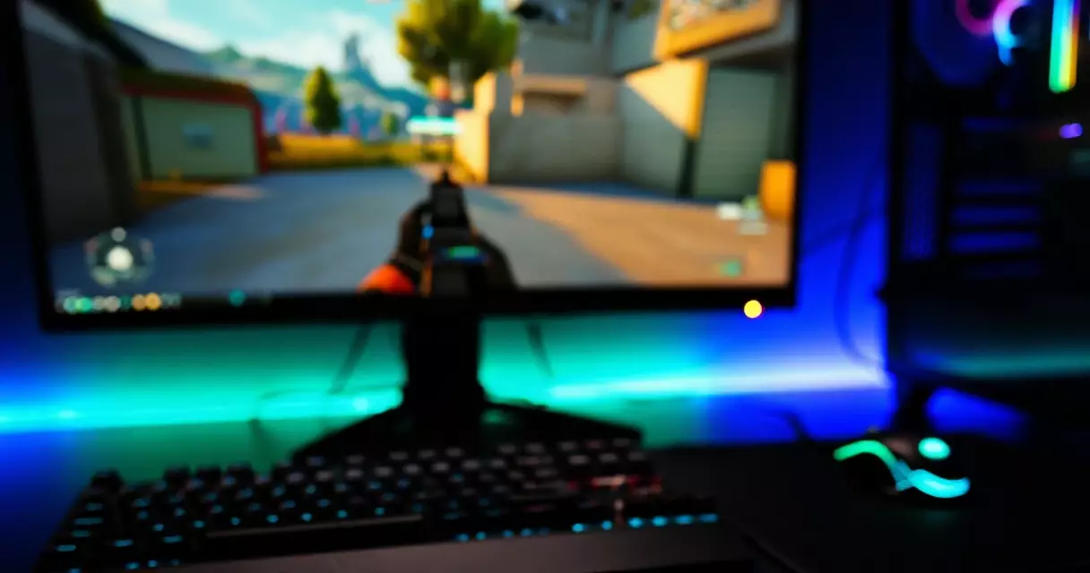 PC gaming setup with monitor displaying a paused action game