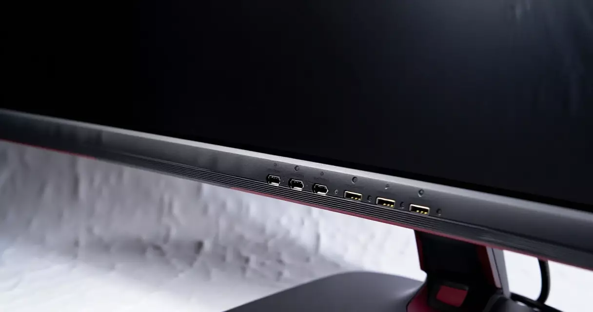 Rear connectivity ports and slim cooling design of a high-end OLED gaming monitor
