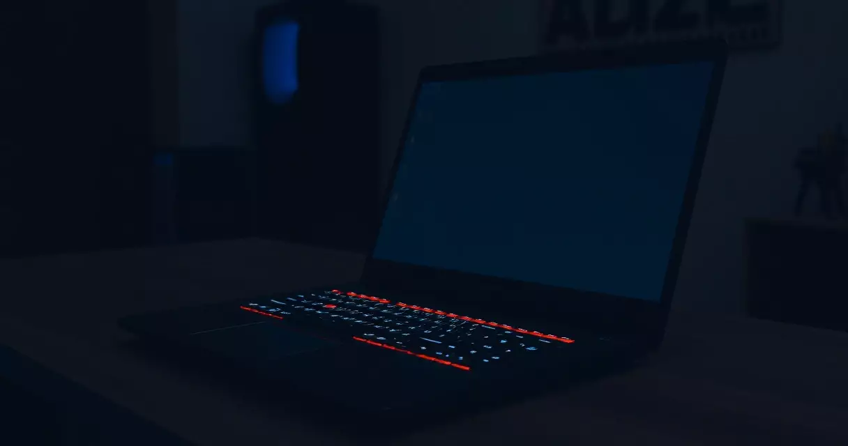 HP Omen 16 gaming laptop open on a desk with backlit keyboard