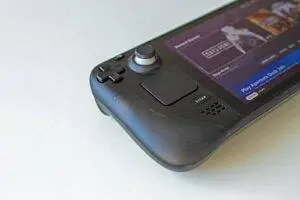 Detailed view of a handheld gaming console showcasing game selection on its screen.