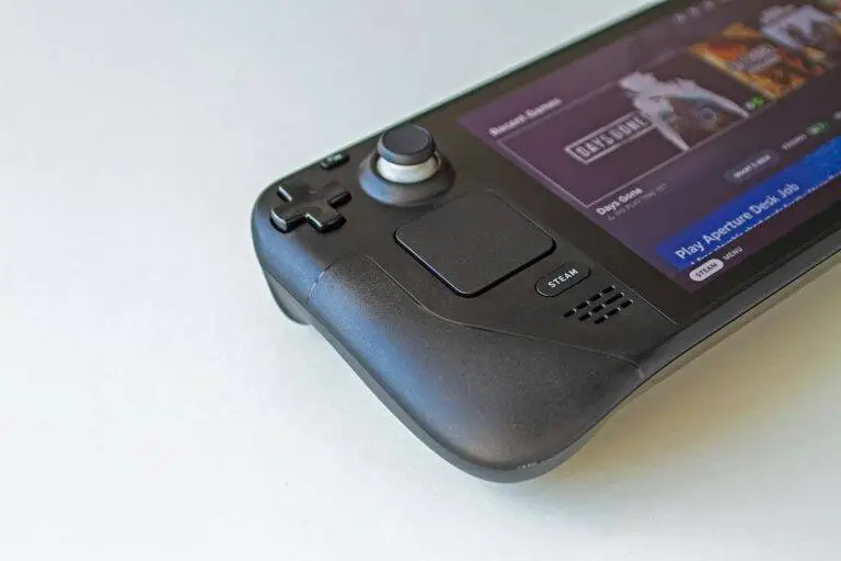 Detailed view of a handheld gaming console showcasing game selection on its screen.