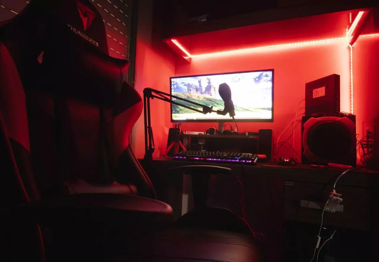 Sleek streaming setup with microphone and neon lights representing Twitch and Kick creator environment in 2026