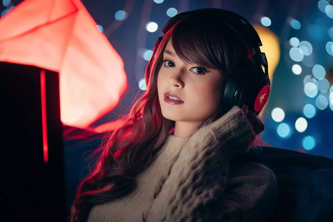 Content creator with headphones in a cozy streaming setup representing vtuber industry growth and monetization trends in 2026